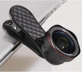 Black mobile phone wide-angle and macro external lens kit with clip and storage case on a table.