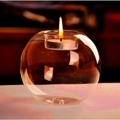 Hand-blown Europe style hollow glass candle holder in round design on table