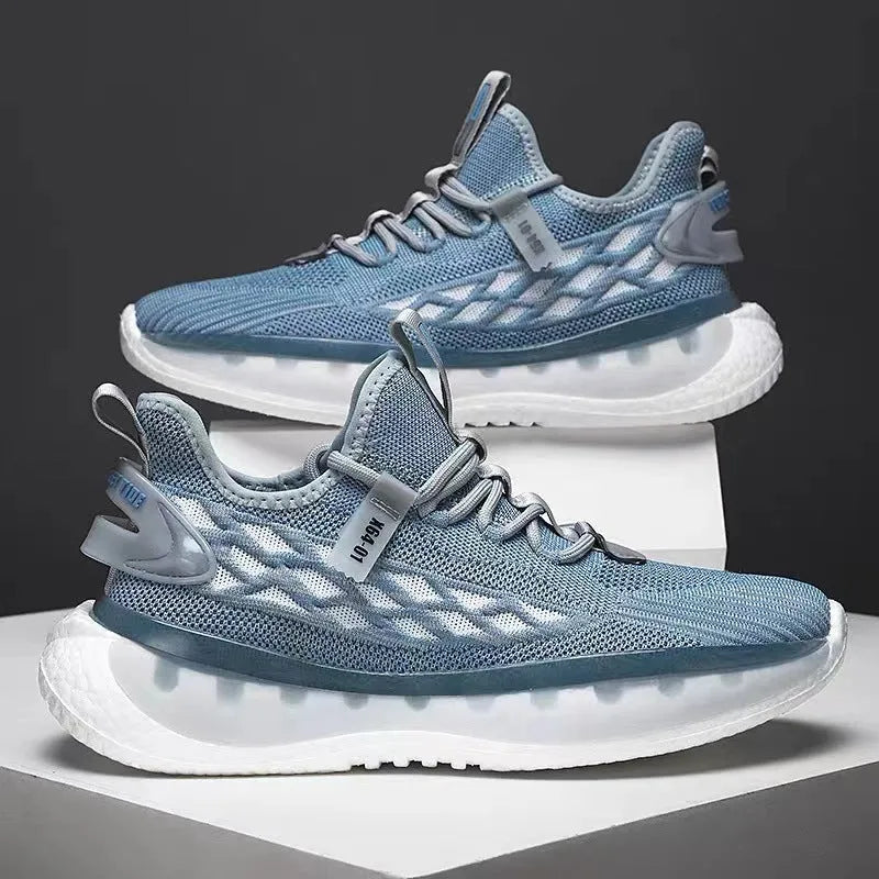 Men's white low-top platform sneakers with mesh upper and flat rubber sole on a plain background.