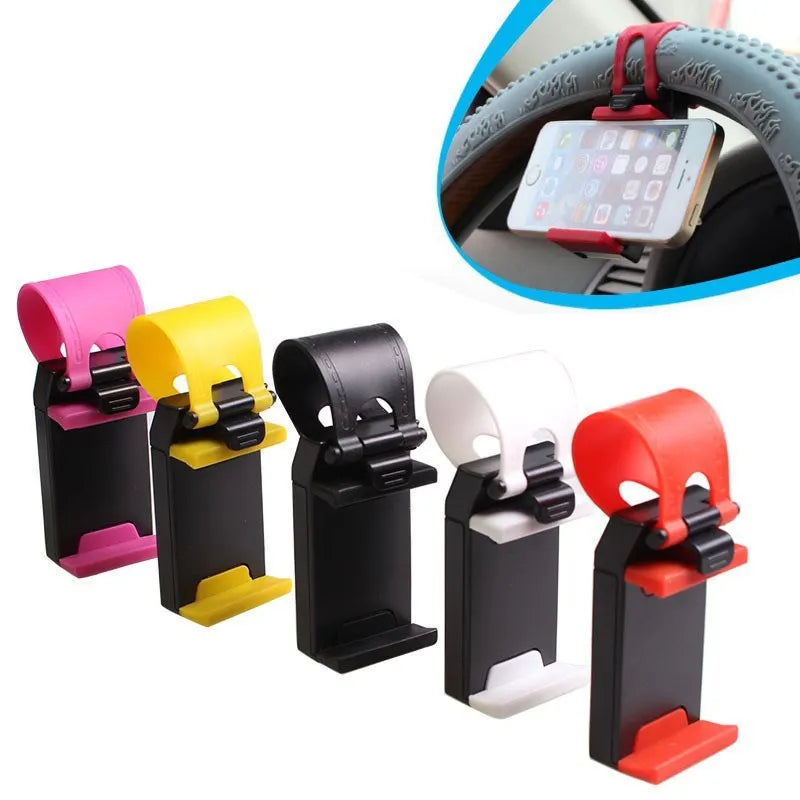 Black universal steering wheel phone holder clip mounted on a car steering wheel with a smartphone secured.