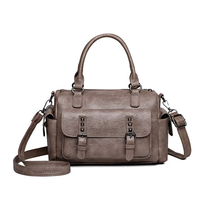 Vintage-style large square messenger bag in PU leather with contrast stitching.