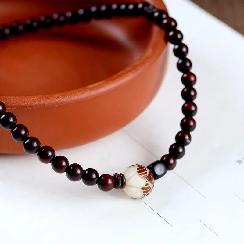Natural rosewood double-ring bracelet with 10mm flower-shaped beads and hand-knitted construction