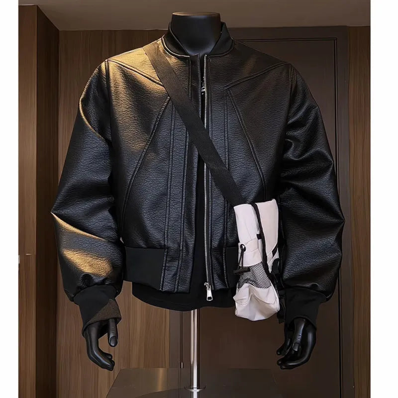 Black extended-length men's PU leather jacket with a litchi texture on a hanger.
