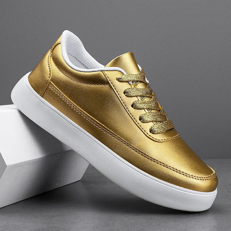 Women's gold leather lace-up casual flat shoes with a flat heel on a white background.