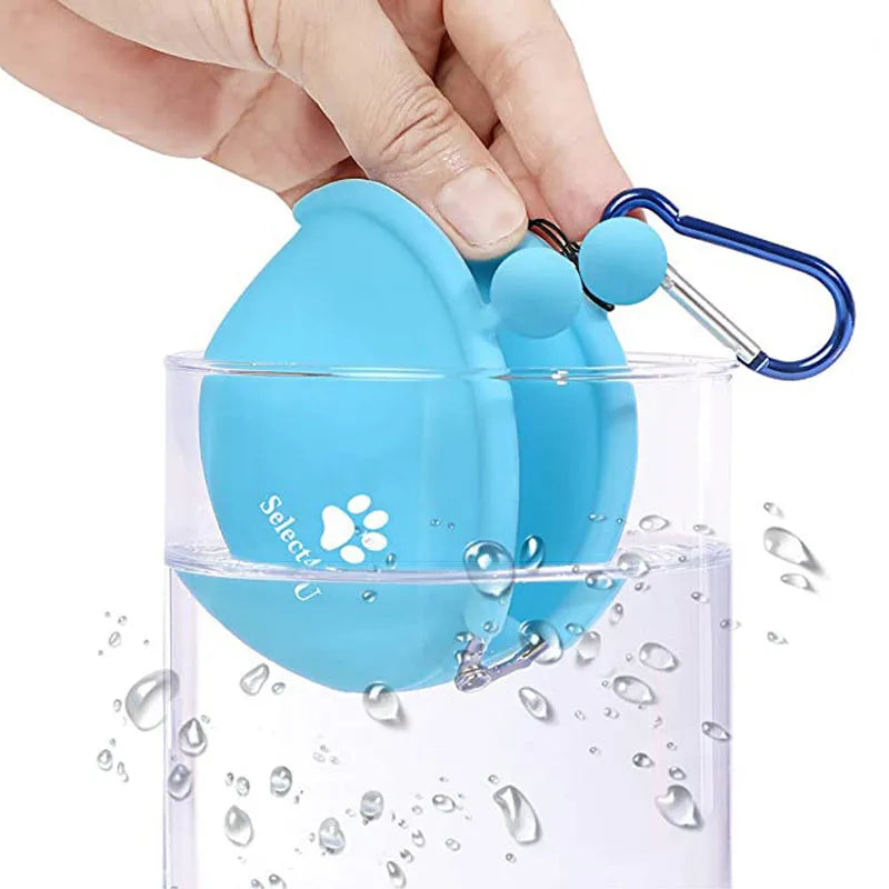 Yellow silicone dog treat pouch with hook-and-loop closure on a waist belt
