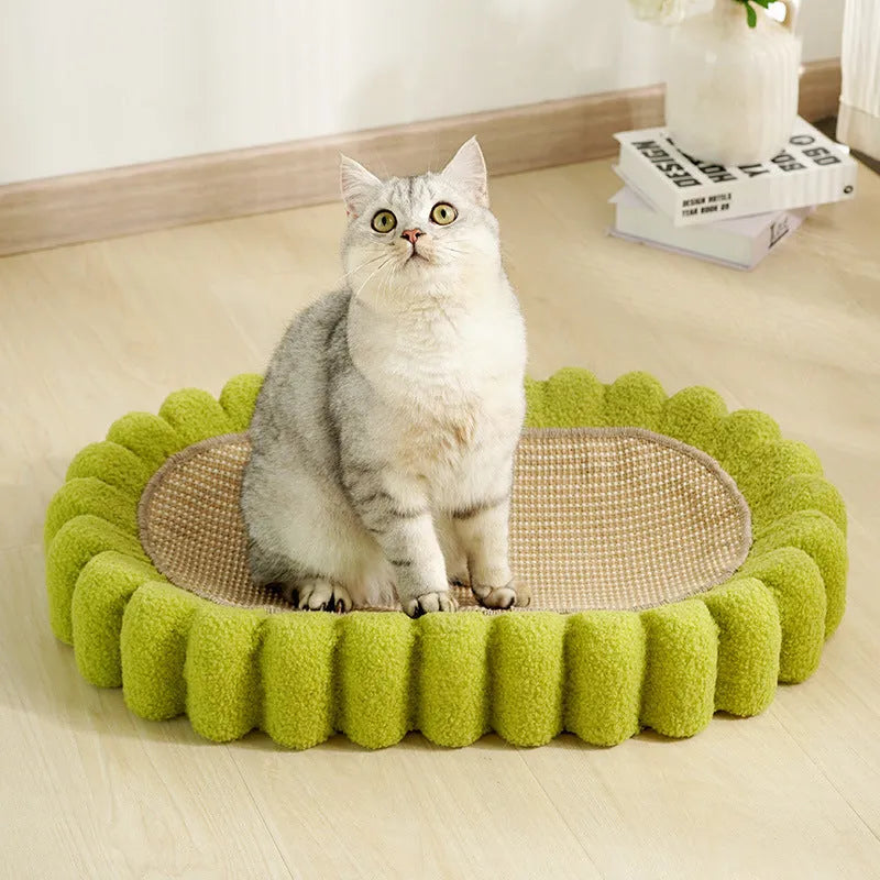 Green oval cat scratcher bed with sisal scratching surface measuring 65x42cm