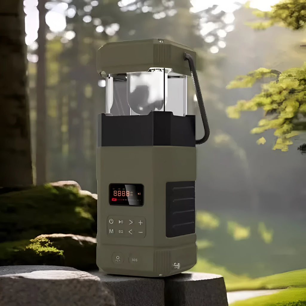 Solar radio Bluetooth speaker camping lantern with hand crank generator and power bank on outdoor background