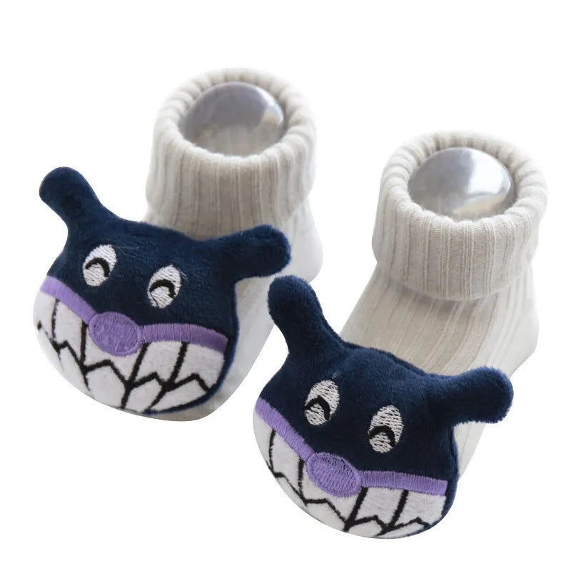 Cotton baby socks in multiple colours and prints including panda, lion, bows, and stars on a white background.