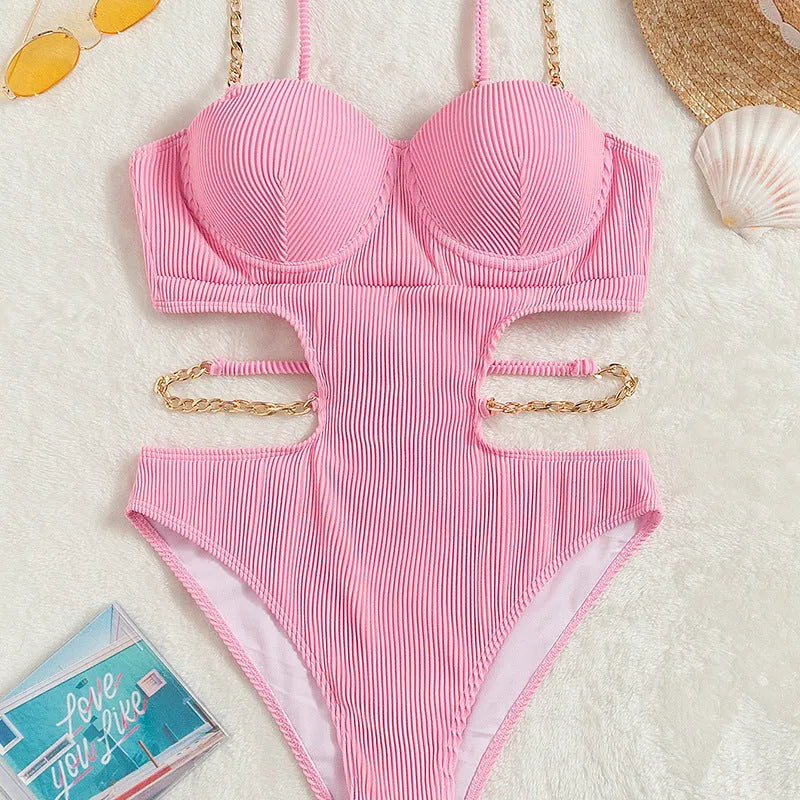 Ladies one piece solid colour swimsuit with chest pad, available in black and pink, sizes S M L