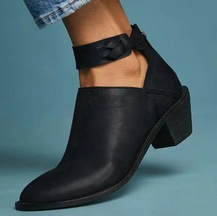 Vintage high heels woman ankle boots with round toe and middle heel in black artificial PU