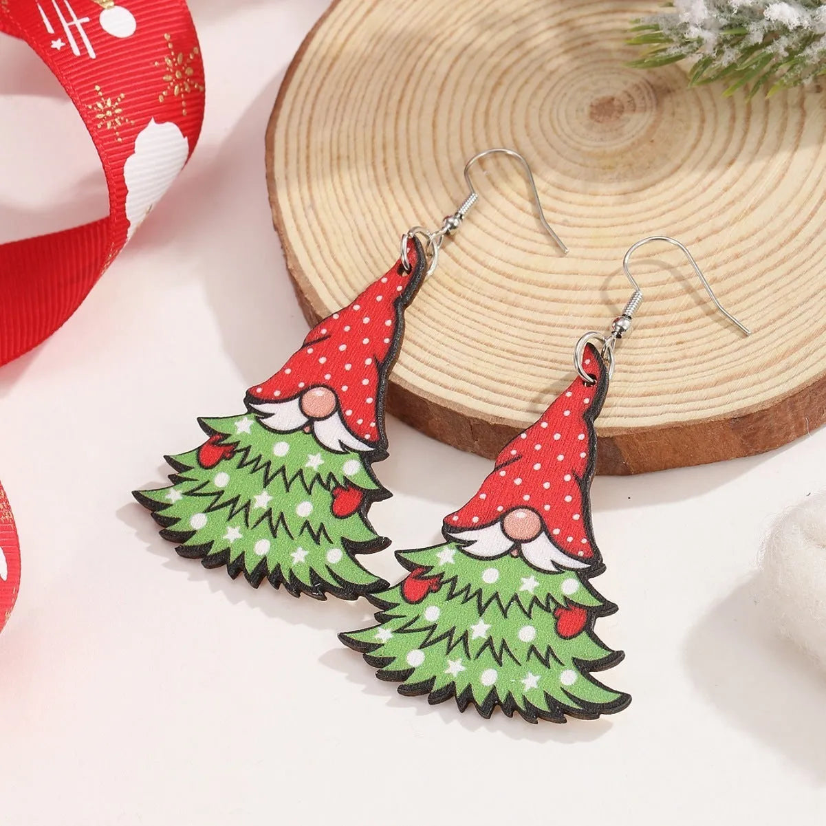Printed wooden Christmas earrings with geometric Santa Claus designs in red and green