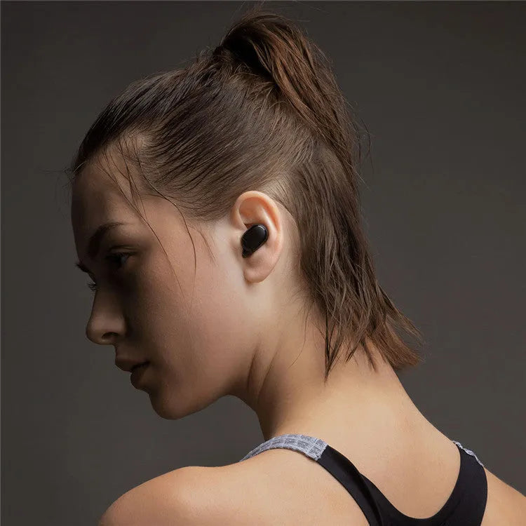 Redmi AirDots Black true wireless earbuds and charging case on a white background.