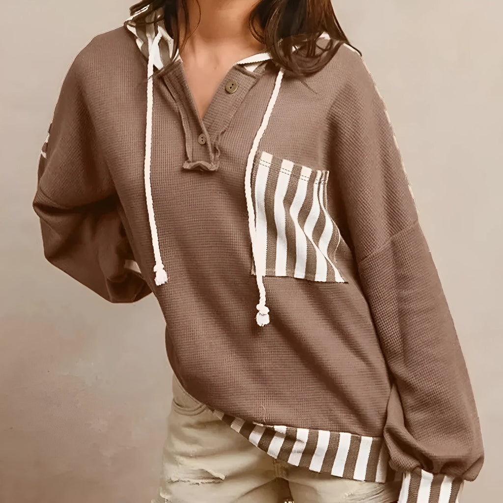 Straw yellow waffle texture hoodie with striped patchwork detail and button neck closure