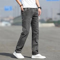 Men's straight-leg smoky gray jeans with low-rise waist and zip fly.