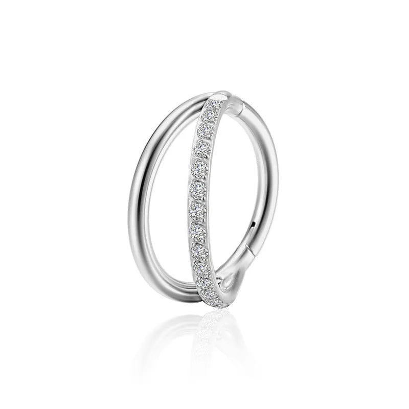 Titanium alloy nose ring piercing jewellery on a plain background showing silver and rose gold colour options.