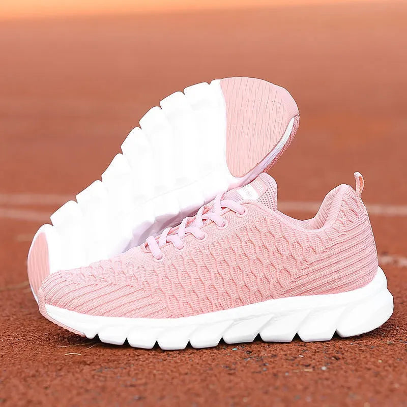 Women's running shoes in black, pink, or white with a fly weaving upper and wear-resistant outsole.