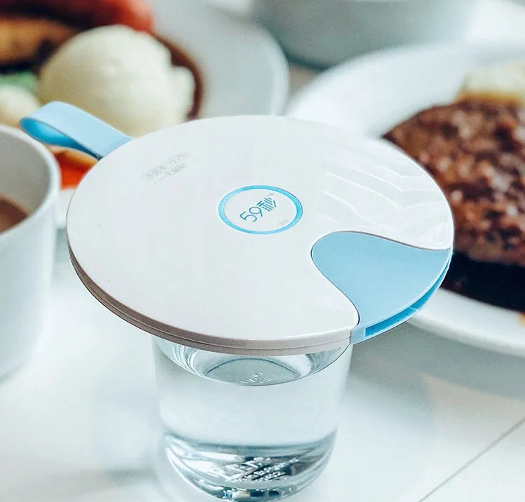 Portable UV baby bottle steriliser in blue or pink, showing compact size and USB port.