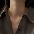 Geometric oval jelly opal pendant necklace on a chain in gold or silver tone.