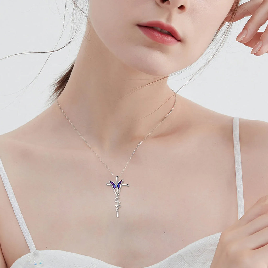 Sterling silver butterfly cross pendant necklace on white gold plated cable chain