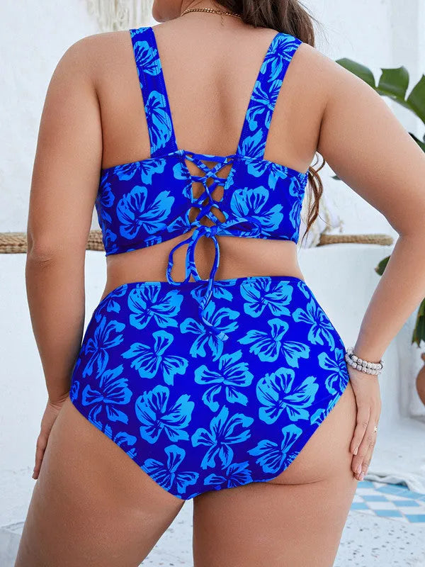 Blue floral print women's plus size bikini set on a hanger.