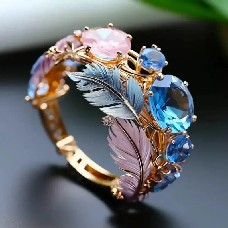 Geometric feather pattern brass ring with inlaid zircon stones in gold colour