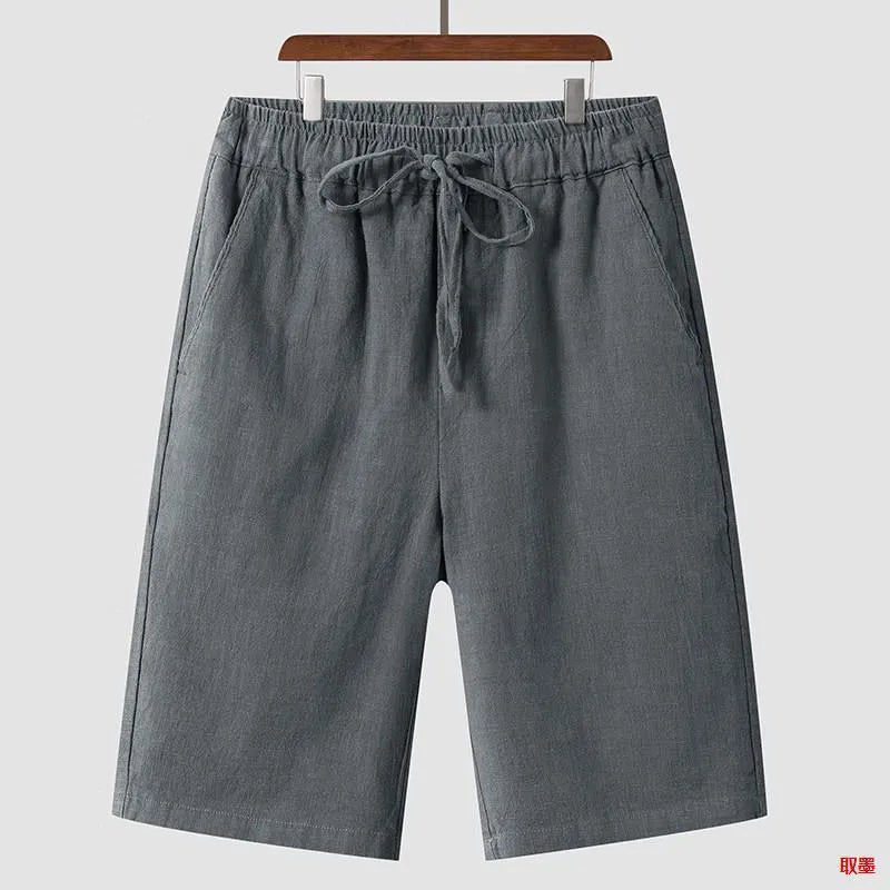 Men's loose-fit linen shorts in a cropped mid-length style with an elastic waistband.