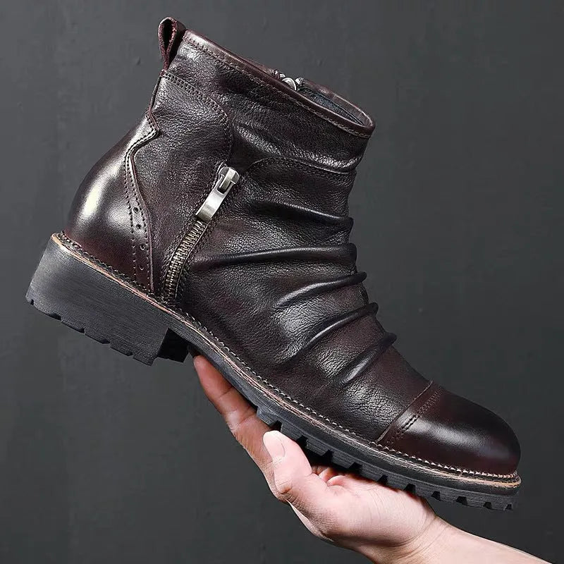 Black cowboy boots with side zip closure, embossed PU uppers, and horseshoe heel on wooden floor