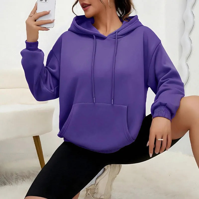 Women's loose drawstring pocket sweatshirt in various colours showing front pockets and adjustable collar