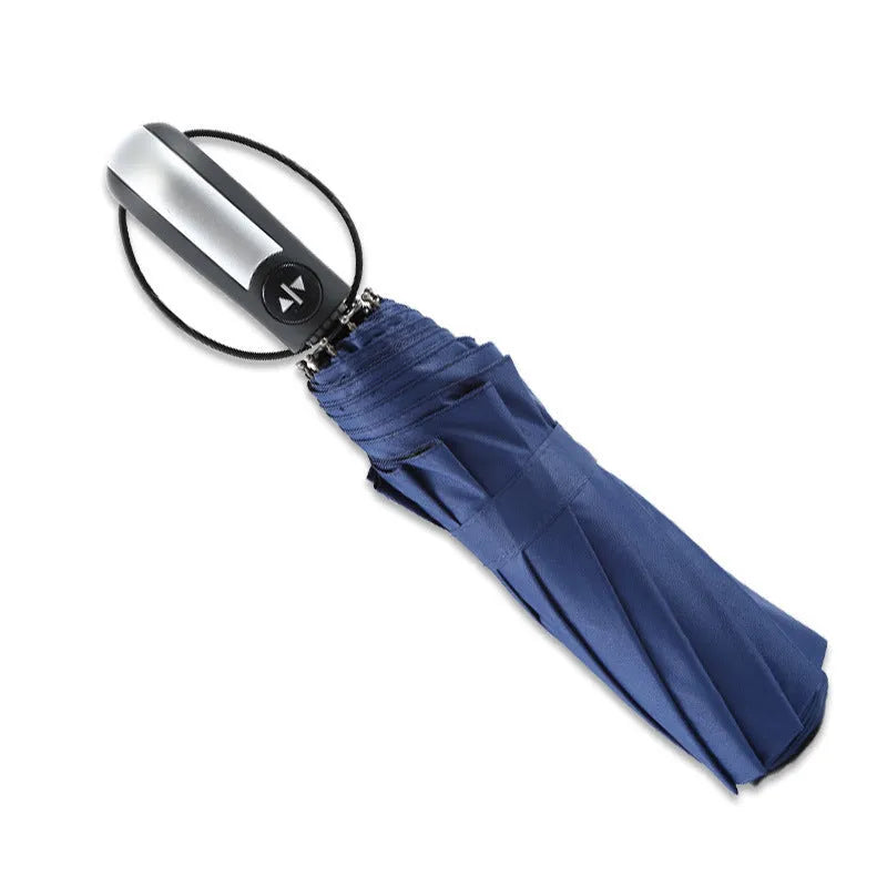 Black triple folding automatic business umbrella with 10 ribs and a rubber handle, shown open.