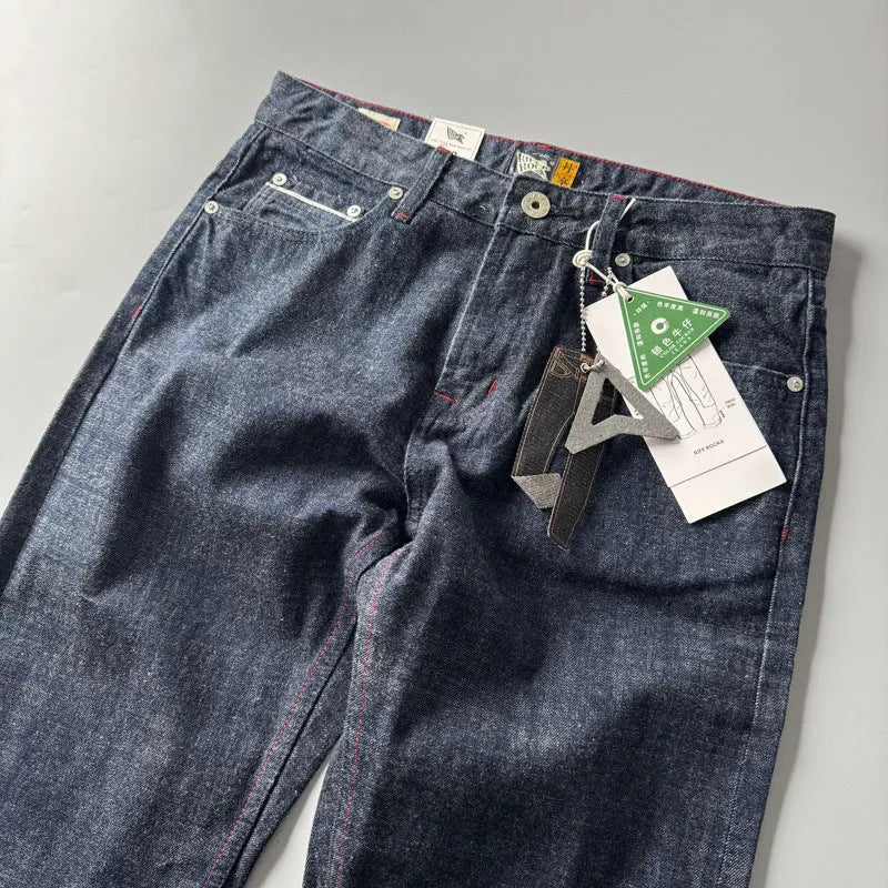 Men's straight leg cotton denim jeans in a primary colour, shown on a mid-waist fit model.
