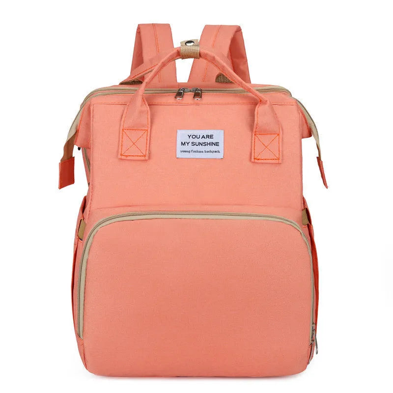 Portable lightweight nylon folding baby changing bag with USB port and shoulder strap in selected colour.
