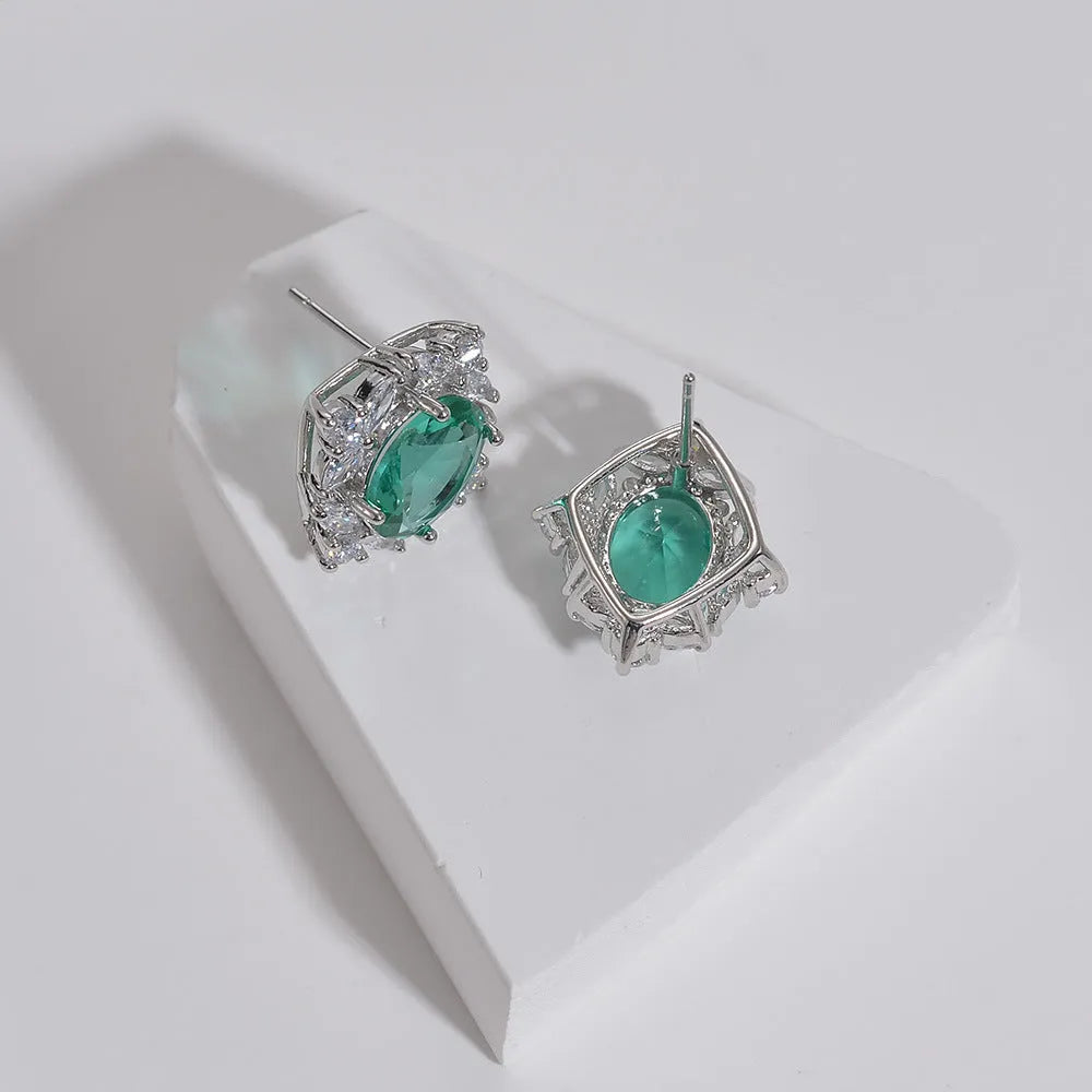 Retro copper oval clip-on earrings with green coloured gem and zircon inlay