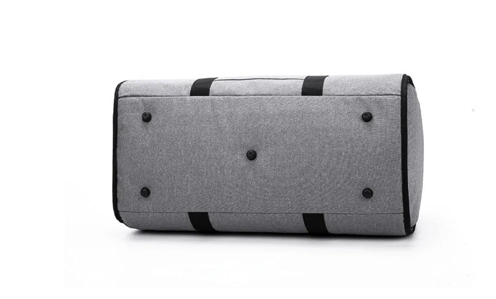 Cylinder-shaped travel bag in Oxford cloth, shown in one of four colours: black, blue, light grey, or red.