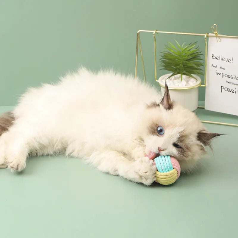 Handmade cotton cat hairball plush toy in blue-pink, green-blue, or pink-green colours, 5cm in diameter.