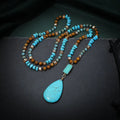 Blue turquoise pendant necklace with mixed gem inlay drop design on ball bead chain