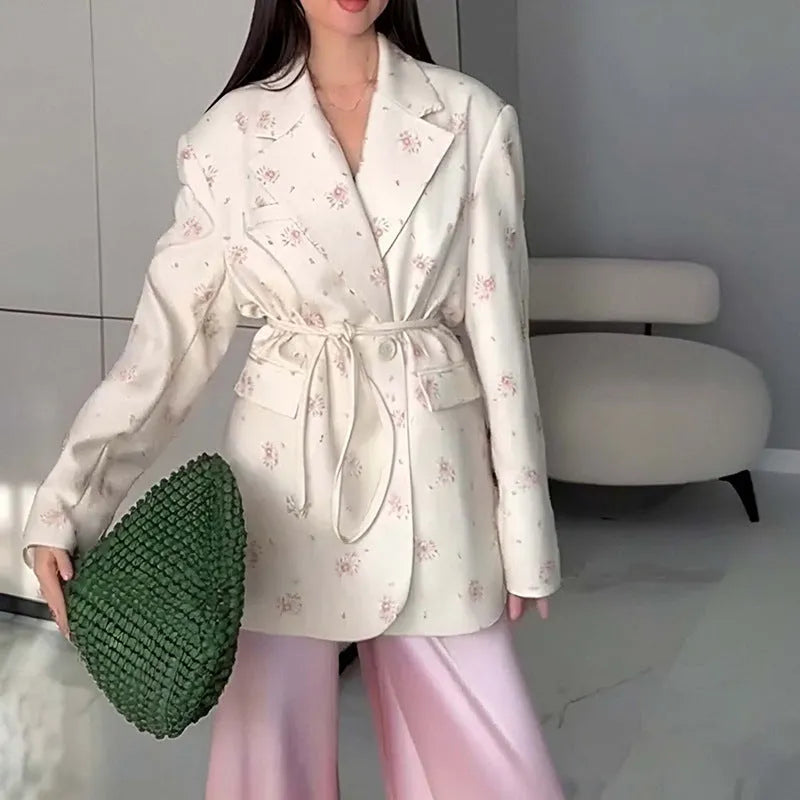 Women's white suit jacket with lace-up detail at collar and waist, long sleeves, regular fit