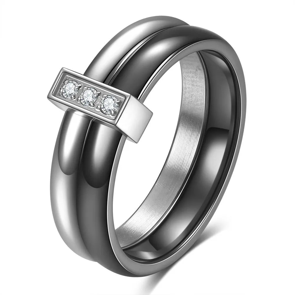 Steel black ceramic women's ring with glossy stitching and zirconium accents, geometric shape.