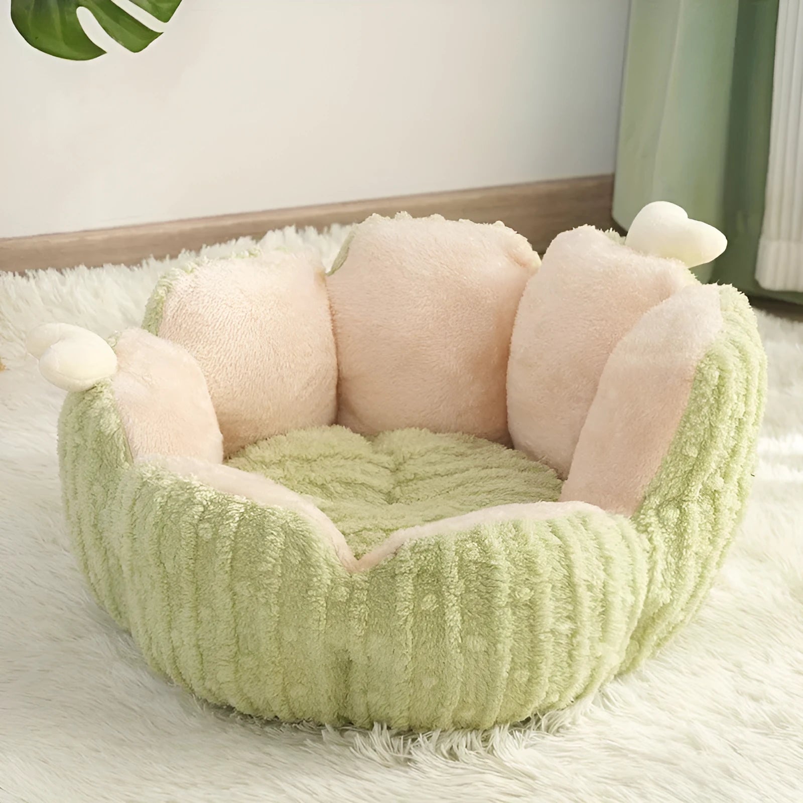 Green soft-lined cat litter kennel with four openings, shown next to a smaller purple version.