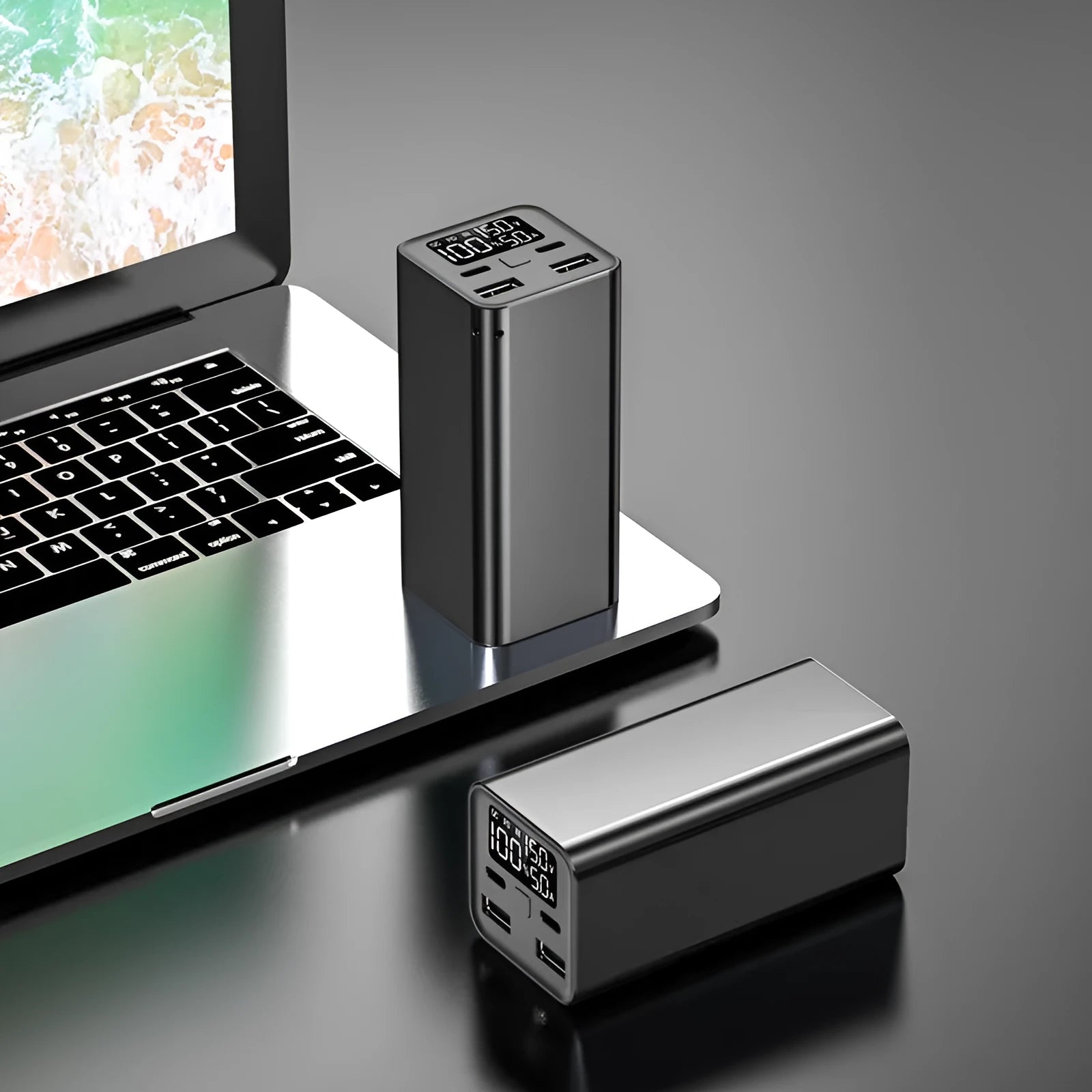 Black high power laptop charging bank with metal case showing size and USB-C port.