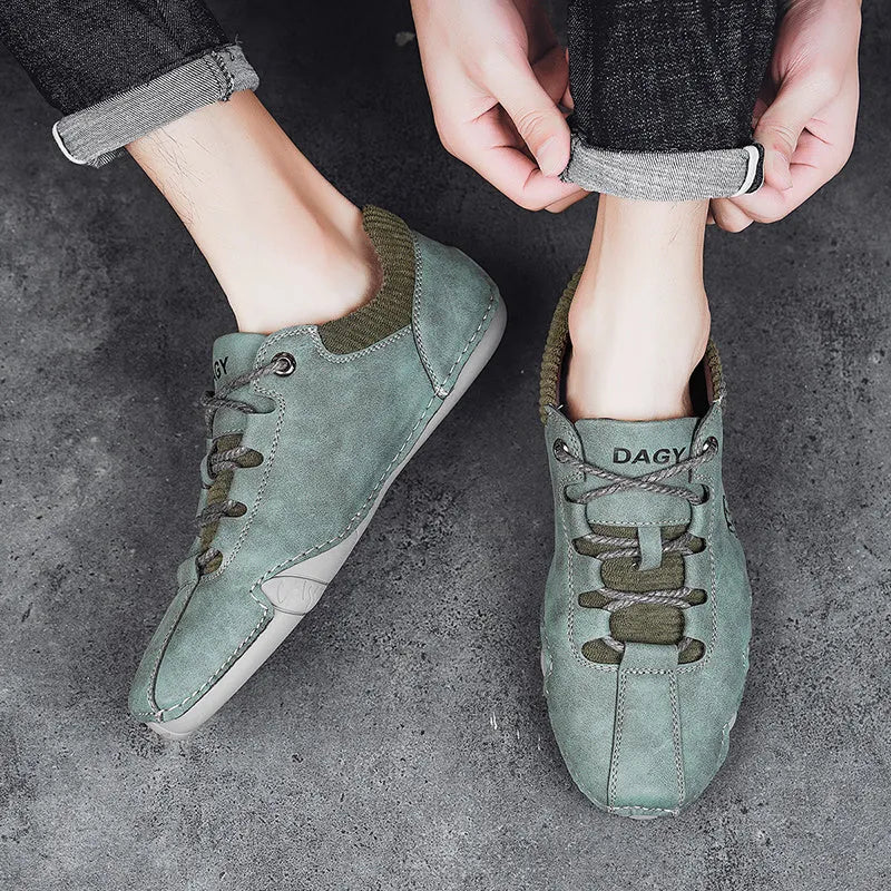 Men's solid colour lace-up casual sneakers with car stitching, blue upper, side view