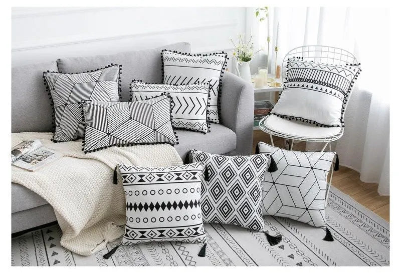 Bohemian style throw pillow on a sofa, available in light grey, black, or white, shown in 45x45cm size.