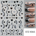 Pack of black and silver strip nail art stickers with cartoon and love pattern designs.