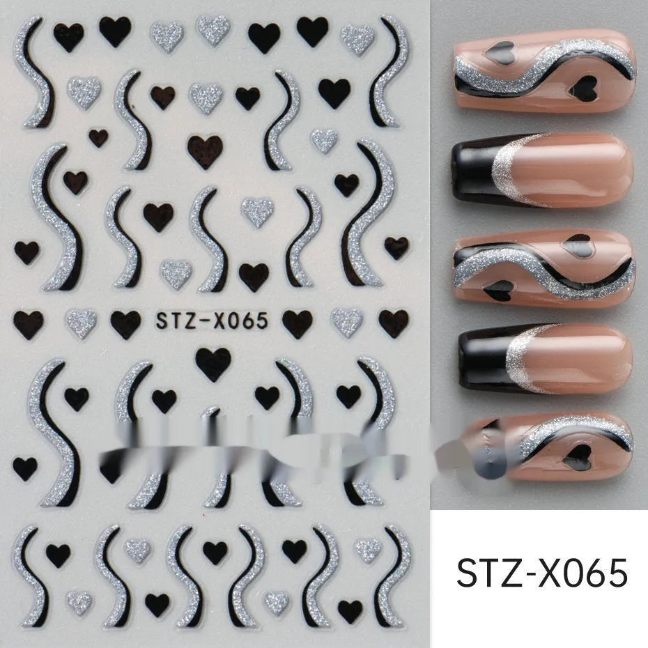 Pack of black and silver strip nail art stickers with cartoon and love pattern designs.