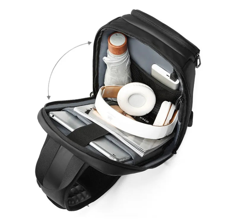 Black PVC outdoor leisure shoulder bag showing air cushion strap and organisational pockets