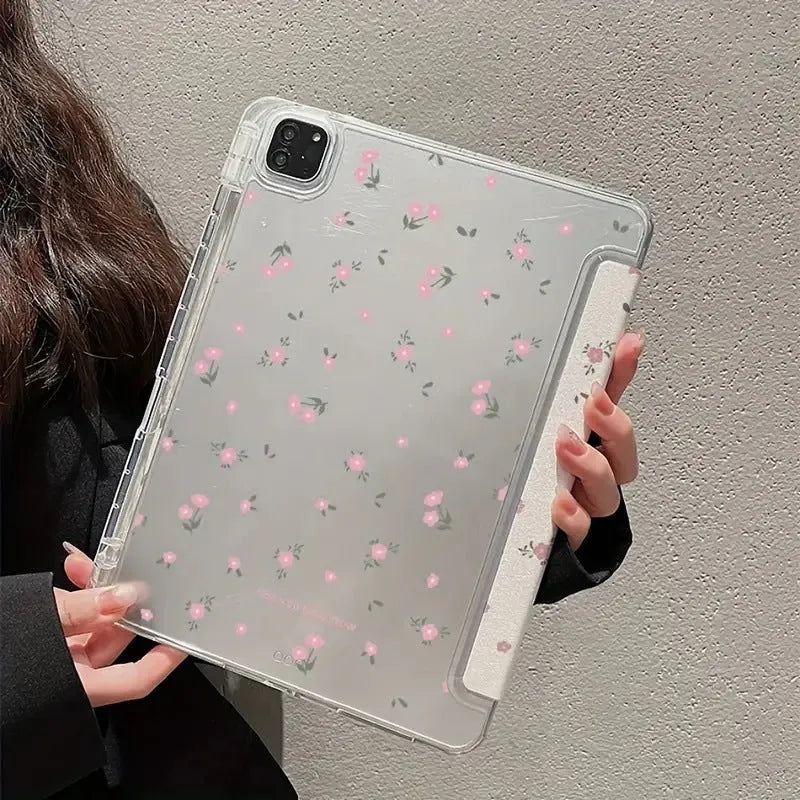 Clear iPad case with floral cartoon pattern, shown folded into a stand position.