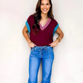 Women's burgundy V-neck sweater with contrast trim and elastic cuffed short sleeves