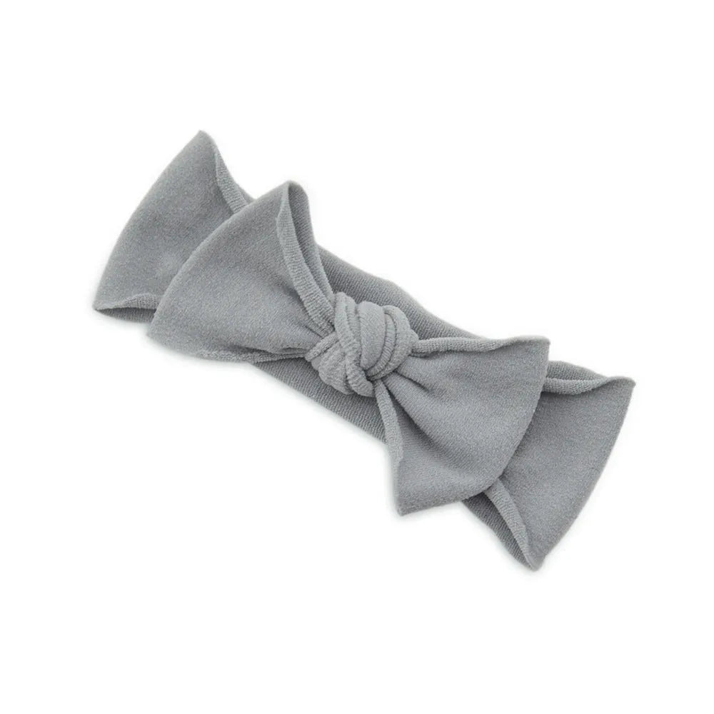 Solid colour knotted cloth headband for baby girls with bowknot design, available in 37 colours