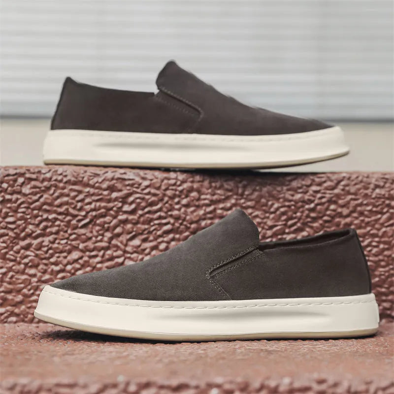Men's grey casual shoes with round toe and sewing line detail on PU upper