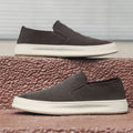 Men's grey casual shoes with round toe and sewing line detail on PU upper