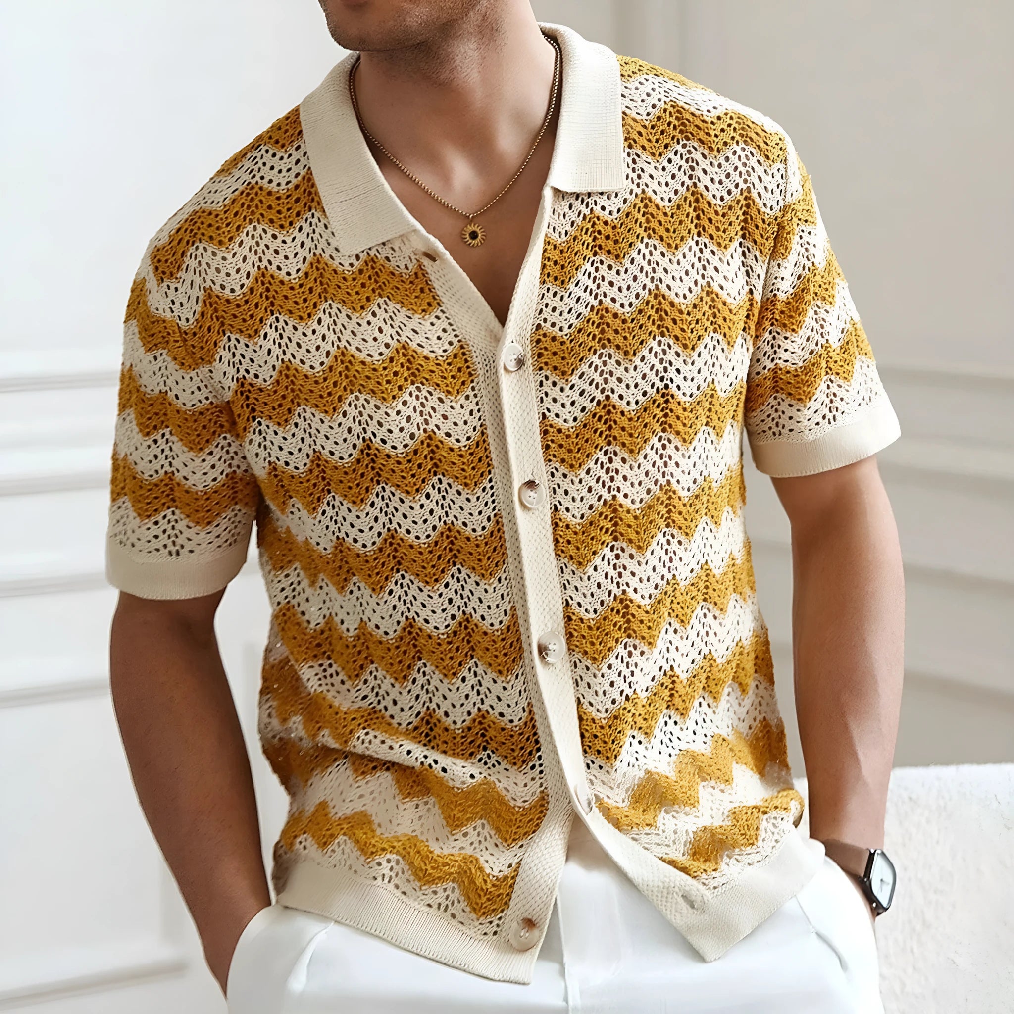 Short-sleeved yellow corrugated sweater with a hollow jacquard texture on a hanger.